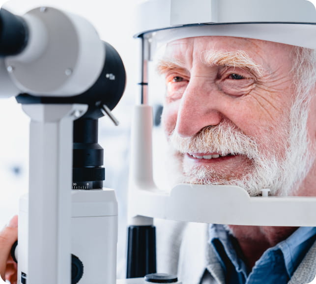 Patient undergoing an eye exam at a slit‑lamp, representing clinical glaucoma screening